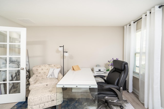 home office featuring a wealth of natural light and light wood-style floors