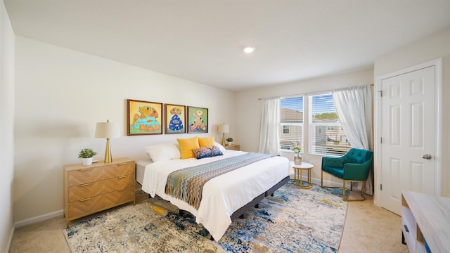 bedroom featuring light colored carpet