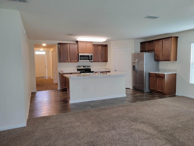 201 Blue Creek Way, Saint Augustine, FL 32086 - kitchen featuring appliances with stainless steel finishes, dark carpet, an island with sink, and light countertops