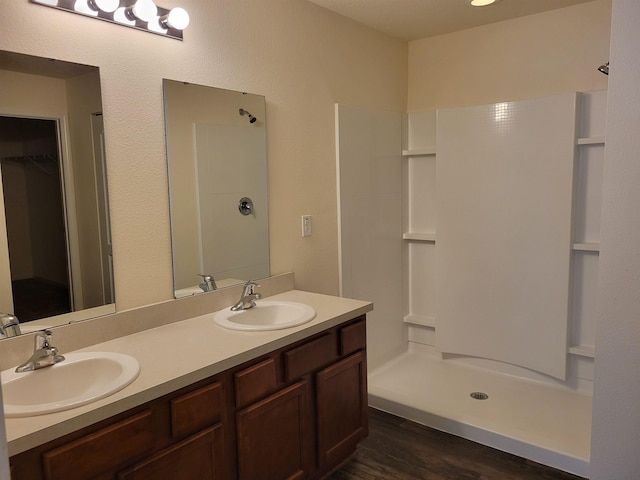 201 Blue Creek Way, Saint Augustine, FL 32086 - full bath with double vanity, wood finished floors, a shower, and a spacious closet