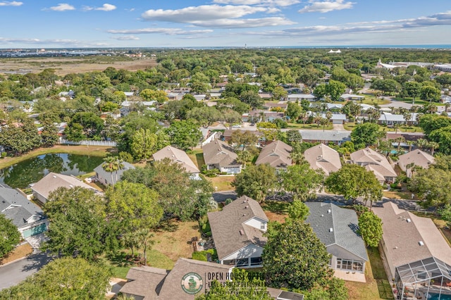 aerial view with a residential view and a water view