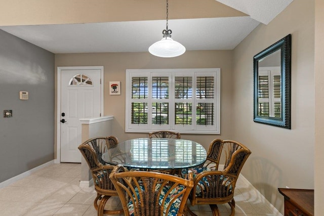 dining room with baseboards and light tile patterned floors