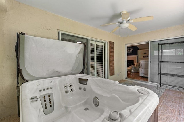 exterior space with a ceiling fan