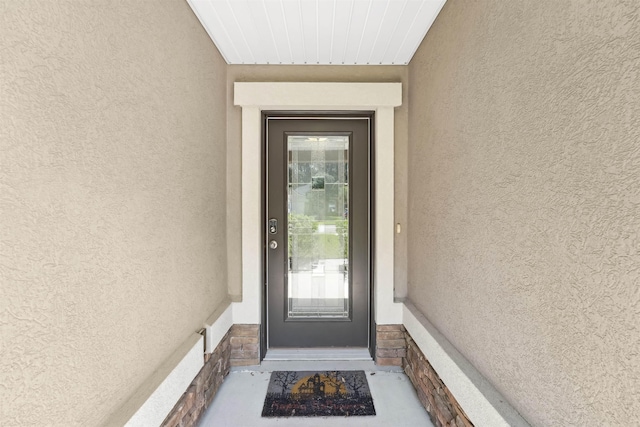 1337 Nochaway Dr, Saint Augustine, FL 32092 - doorway to property with stucco siding