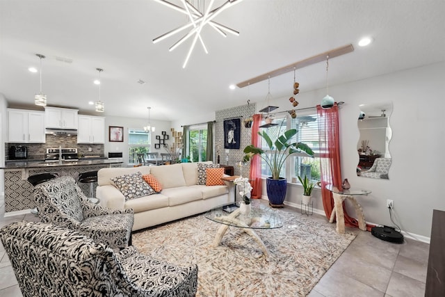 1337 Nochaway Dr, Saint Augustine, FL 32092 - living room with a chandelier, recessed lighting, light tile patterned floors, and baseboards