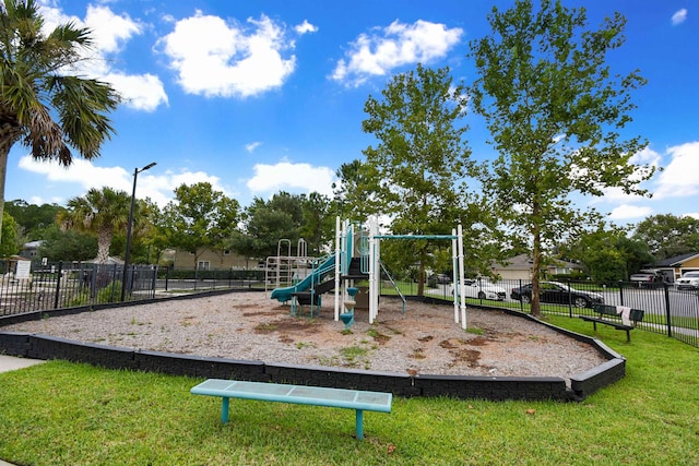 view of playground with a yard