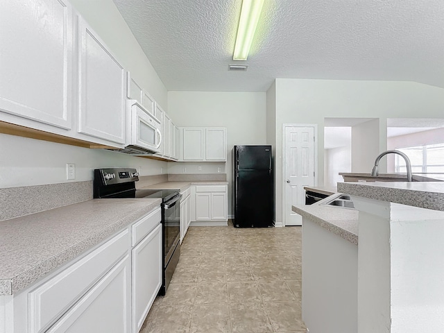 kitchen with black appliances, white cabinets, and a textured ceiling