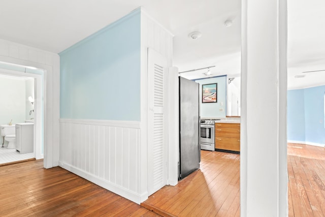 26 Ponce De Leon Ave, Saint Augustine, FL 32080 - corridor featuring light wood finished floors and wainscoting