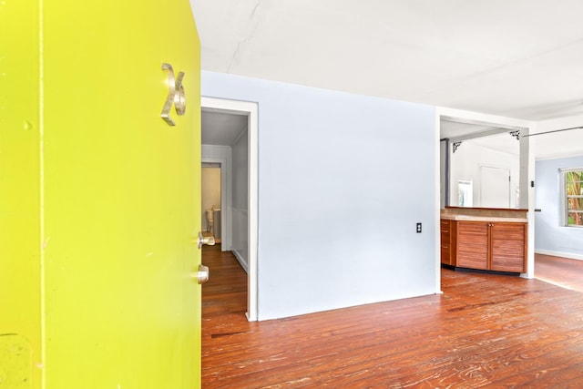 empty room with hardwood / wood-style flooring