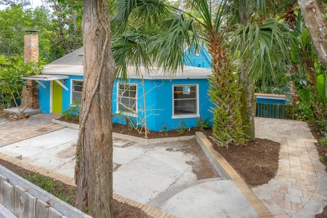 26 Ponce De Leon Ave, Saint Augustine, FL 32080 - view of front of property with a chimney and stucco siding