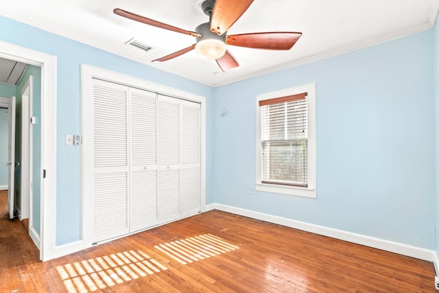 26 Ponce De Leon Ave, Saint Augustine, FL 32080 - unfurnished bedroom with a closet, hardwood / wood-style flooring, attic access, and ceiling fan