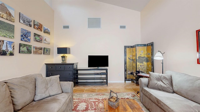 23 Fancher Ct, Saint Augustine, FL 32080 - tiled living room with high vaulted ceiling and baseboards