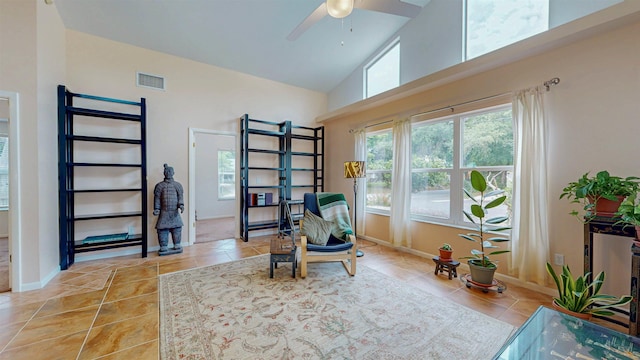 23 Fancher Ct, Saint Augustine, FL 32080 - living area featuring light tile patterned floors, high vaulted ceiling, ceiling fan, and baseboards