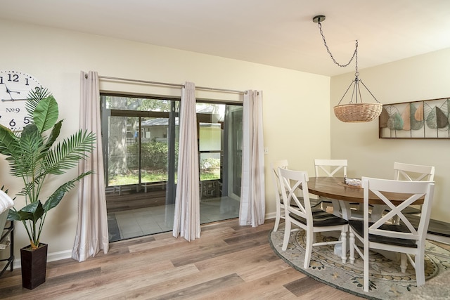 dining space with light wood-type flooring