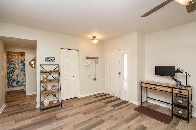 entrance foyer featuring ceiling fan and hardwood / wood-style floors