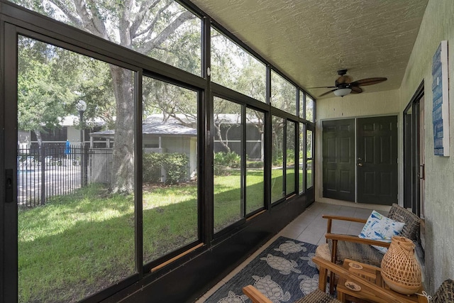 sunroom featuring plenty of natural light and ceiling fan