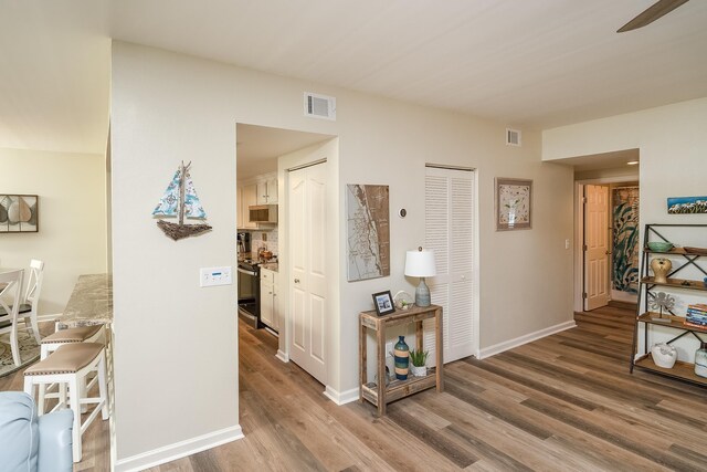 corridor featuring hardwood / wood-style flooring