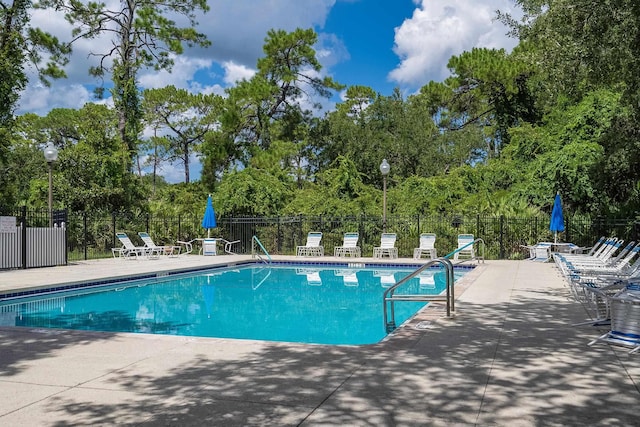 view of swimming pool featuring a patio