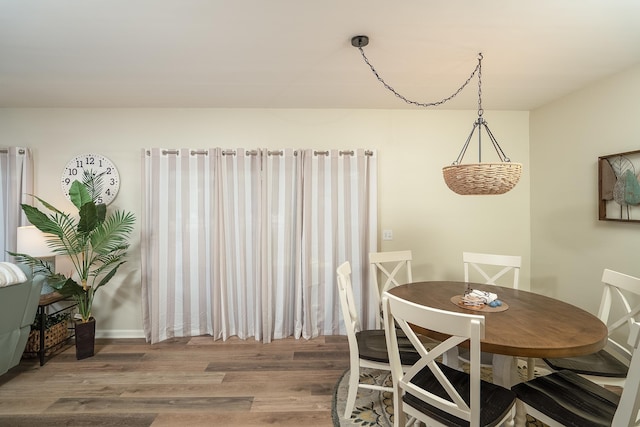 dining area with hardwood / wood-style floors