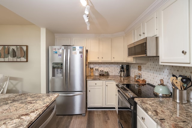 kitchen featuring white cabinetry, appliances with stainless steel finishes, and light stone countertops