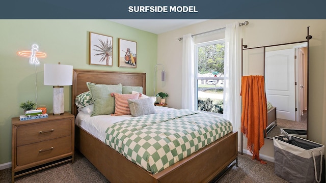 bedroom featuring dark colored carpet