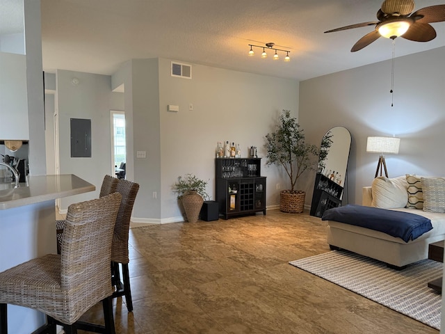 1804 Prestwick Pl Unit 1804, Saint Augustine, FL 32086 - living room with baseboards, ceiling fan, electric panel, and visible vents