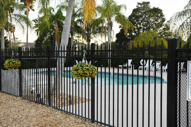 1804 Prestwick Pl Unit 1804, Saint Augustine, FL 32086 - view of gate featuring a patio, a community pool, and fence