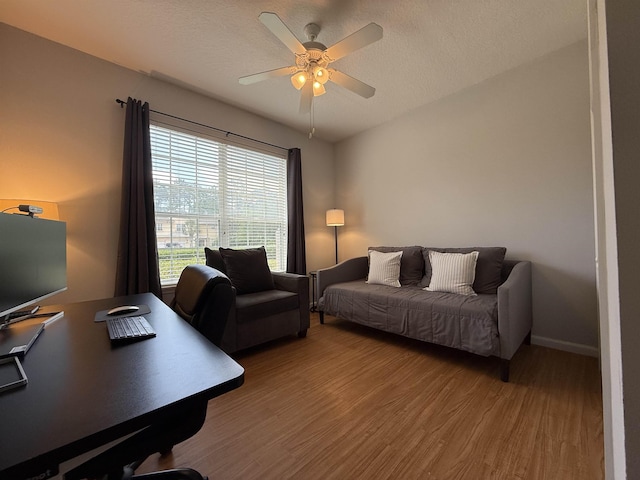 1804 Prestwick Pl Unit 1804, Saint Augustine, FL 32086 - home office with baseboards, a textured ceiling, ceiling fan, and wood finished floors