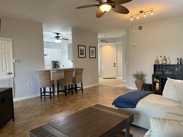 1804 Prestwick Pl Unit 1804, Saint Augustine, FL 32086 - living area with visible vents, a ceiling fan, and baseboards