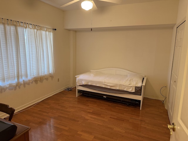 bedroom featuring ceiling fan, a closet, and wood-type flooring