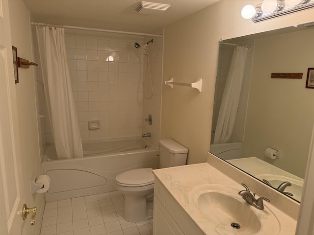 full bathroom featuring tile patterned flooring, a textured ceiling, toilet, shower / tub combo with curtain, and vanity