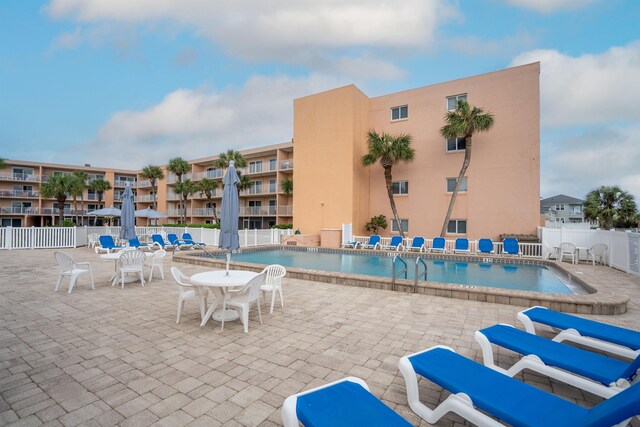 view of swimming pool featuring a patio