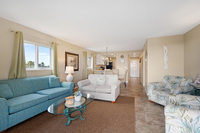 living room featuring a notable chandelier