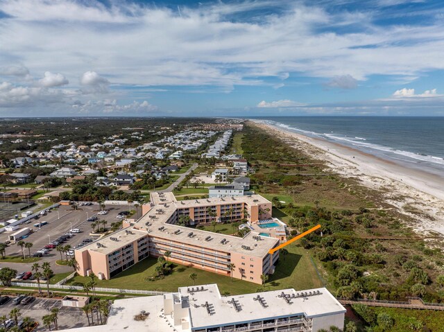 aerial view featuring a water view and a beach view