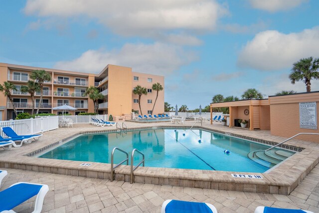 view of pool featuring a patio