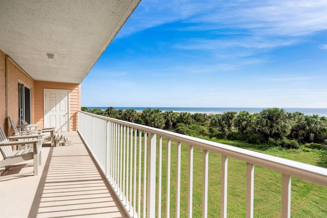 balcony featuring a water view