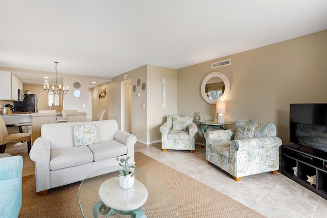 tiled living room with an inviting chandelier