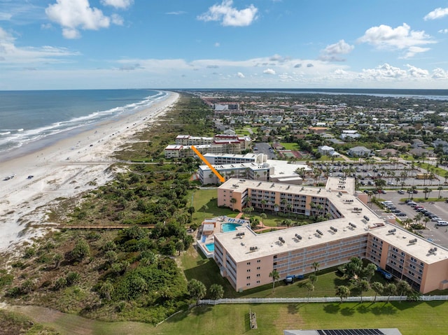 bird's eye view with a view of the beach and a water view