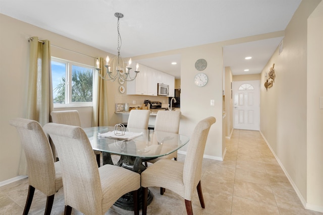 tiled dining room with a chandelier