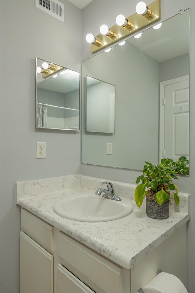 bathroom featuring vanity and walk in shower