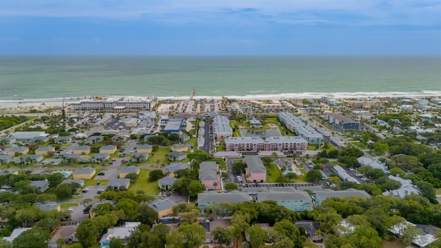 birds eye view of property with a water view and a view of the beach