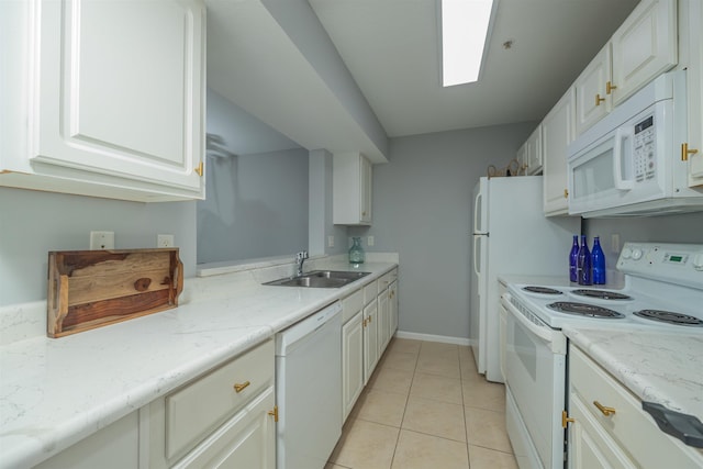 kitchen with sink, light tile patterned floors, white appliances, light stone countertops, and white cabinets