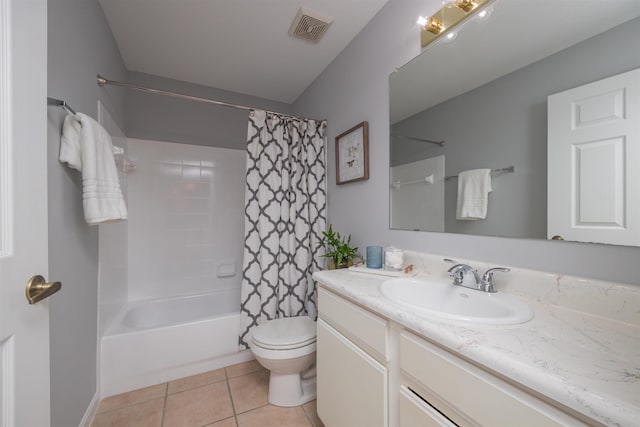 full bathroom featuring tile patterned flooring, vanity, toilet, and shower / bath combo with shower curtain