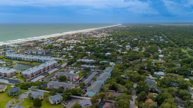 bird's eye view with a water view and a beach view