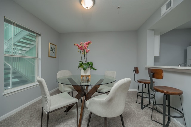 view of carpeted dining area