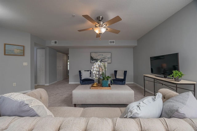 living room with light colored carpet and ceiling fan