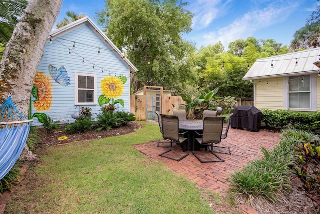 view of yard featuring a patio area and a storage shed