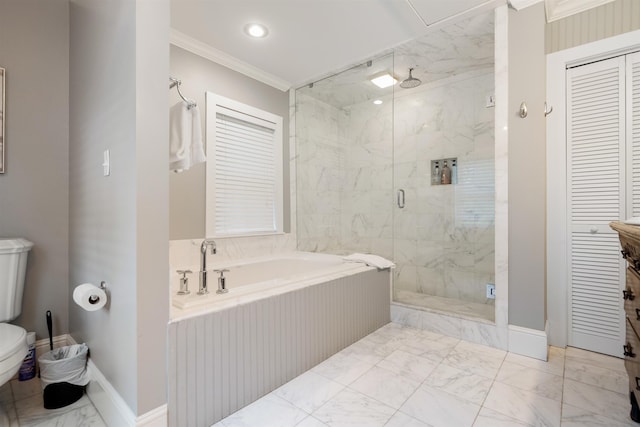 bathroom featuring separate shower and tub, toilet, and ornamental molding