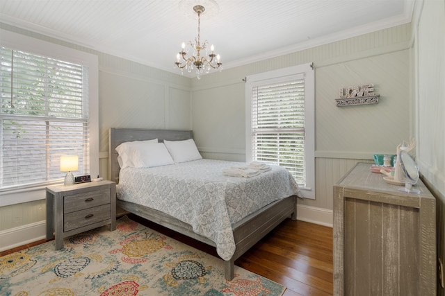 15 Rohde Ave, Saint Augustine, FL 32084 - bedroom featuring multiple windows, crown molding, hardwood / wood-style floors, and a chandelier