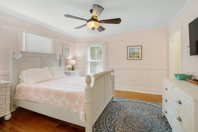 bedroom featuring ceiling fan, hardwood / wood-style floors, and crown molding